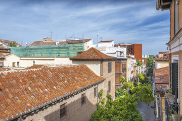 Obraz premium Rooftops of vintage buildings with clay tiles in the historic center of Madrid