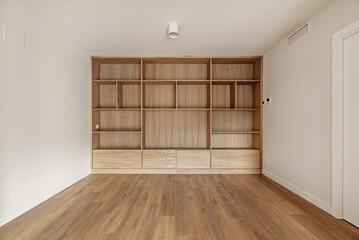 Custom made oak bookcase with shelves and drawers in the lower part