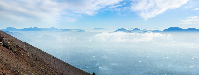 Morning cloudy top view of Naples city from Vesuvius mount slope (Italy). Panorama.