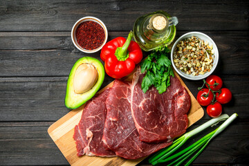 Healthy food. Raw beef meat with organic food assortment .