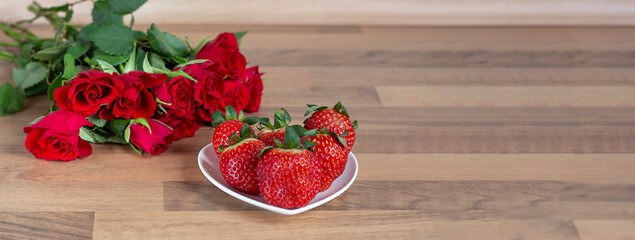 Valentine. Valentine background. Valentine's day concept red roses and strawberries in a plate