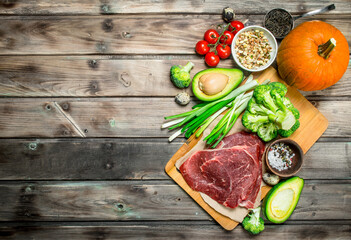 Healthy food. Variety of organic food with raw beef meat.