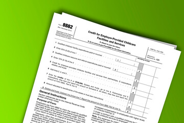 Form 8882 documentation published IRS USA 09.22.2017. American tax document on colored