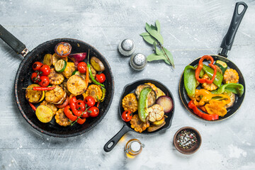 Assortment of grilled vegetables with spices and herbs.