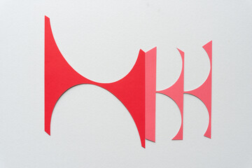 cut paper stencils with semi-circular or oval shapes