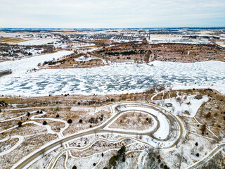 Aerial image of a Frozen and snow covered lake in a city park