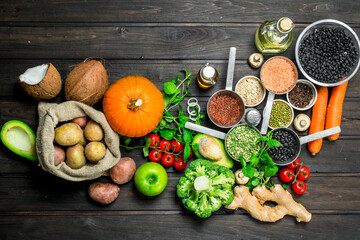Fototapeta na wymiar Organic food. Healthy assortment of vegetables and fruits with legumes.