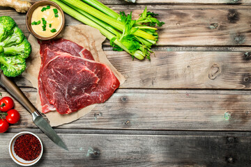 Healthy food. Raw beef with a variety of organic food and spices.
