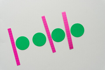 green paper circles and pink lines on blank paper