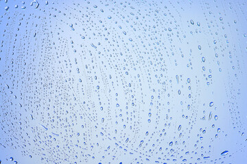 drops glass blue background abstract, transparent cold background water splashes