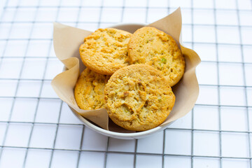 pistachio and almond cookies on white background.