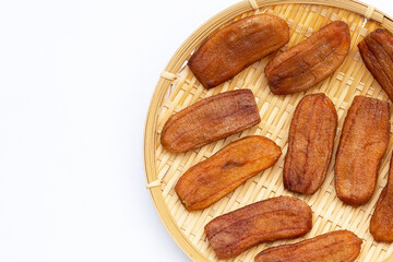 Sun dried bananas on white background.