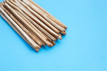 Bread sticks on blue background