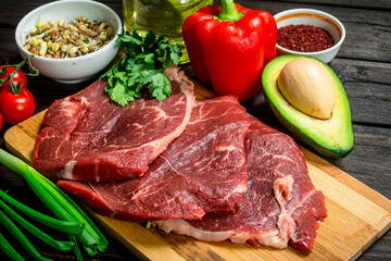 Healthy food. Raw beef meat with organic food assortment .