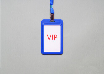 Plastic vip badge on light gray background, top view