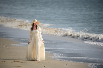 Fototapeta na wymiar women in white dress on beach