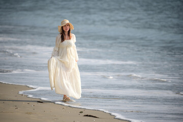 Fototapeta na wymiar woman in dress on the beach