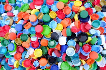 lots of Colored plastic bottle caps - obrazy, fototapety, plakaty