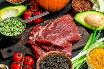 Healthy food. Organic food assortment with raw beef steaks .