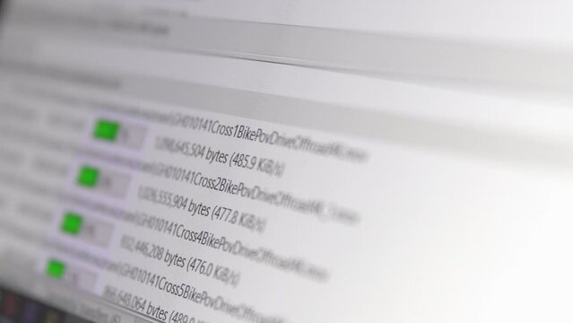 Multiple FTP file transfers going on computer at high internet speed, selective focus
