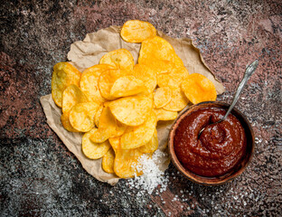 Potato chips with tomato sauce and salt.