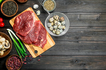 Healthy food. Raw beef meat with organic food assortment .