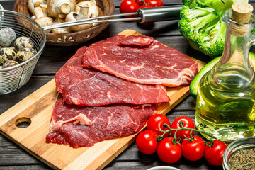 Healthy food. Raw beef meat with organic food assortment .