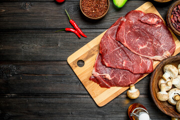 Healthy food. Raw beef with a variety of organic food and spices.