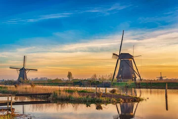 Rolgordijnen Rotterdam Netherlands, sunrise nature landscape of Dutch Windmill at Kinderdijk Village © Noppasinw