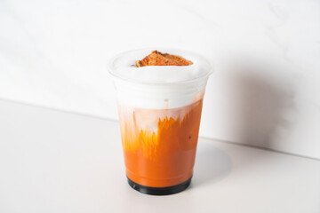 Thai tea with milk and bael on top