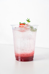 strawberry with soda in glass