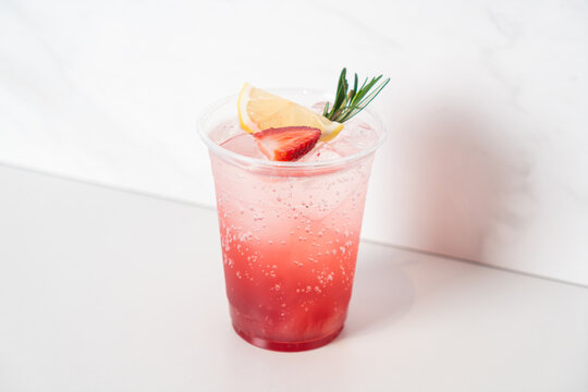 strawberry with soda in glass