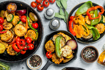 Assortment of grilled vegetables with spices and herbs.