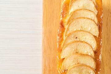 apple loaf crumbled on wood board