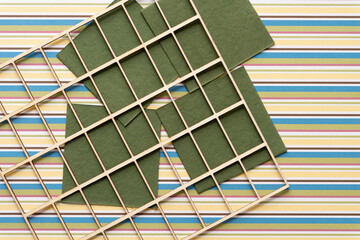 wood grid or lattice on green card tiles and striped scrapbook paper