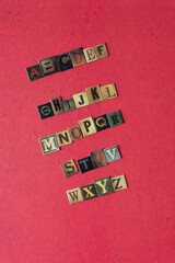 alphabet composed of chipboard tiles displaying vintage style letters