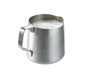 metallic pitcher with whipped milk isolated on white background . Stainless steel milk pitcher jug...