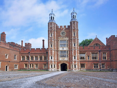 Eton, England :  The facade and clocktower of the main building on the campus of Eton College, an elite boys' private school.
