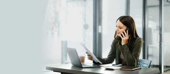 Attractive caucasian business woman top manager working with laptop tablet cojmputer planning financial strategy analyst and global stock market and sector indices trading data.