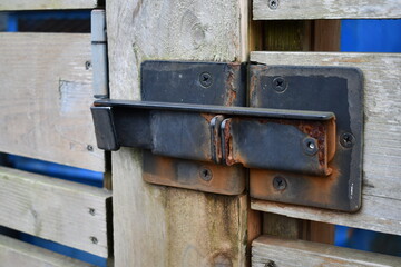 rusted unlocked gate latch