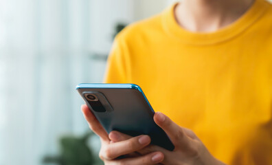 Hand holding smartphone with using social media on internet.
