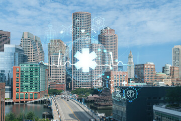Naklejka premium Panorama city view of Boston Harbor at day time, Massachusetts. Buildings of financial downtown. Glowing healthcare digital medicine icons. The concept of treatment from disease, Threat of pandemic