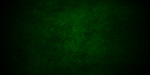 Dark green background with grunge backdrop texture, watercolor painted mottled green background, colorful bright ink and watercolor textures on black paper background.