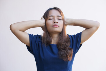 Naklejka na ściany i meble Asian women suffer from work stress. Put your hand on your head
