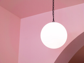 a lamp hanging from the ceiling. minimalism