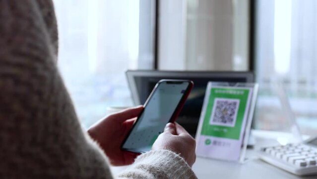 Scan QR code payment using smartphone.