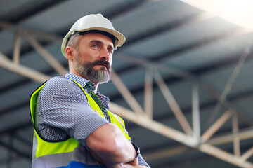Fototapeta Portrait Caucasian professional Engineer factory. Engineering worker in safety hardhat at factory industrial facilities. Heavy Industry Manufacturing Factory obraz