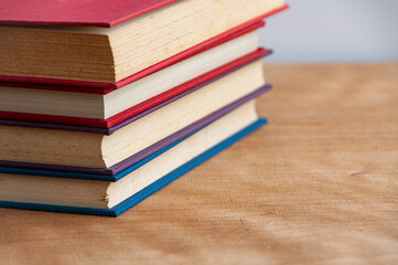 Books on wooden table with customizable space for text or ideas. Copy space and education concept.
