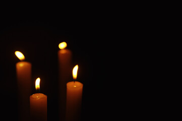 Burning candle Wick from a candle in a flame of fire. Symbol of sadness and loneliness. A time of condolences. Burning wax candle. Religion.
