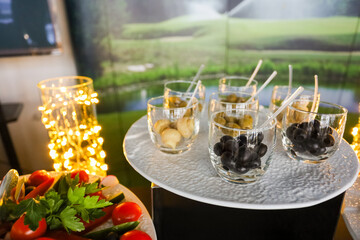 Beautifully decorated catering banquet table with different food snacks . High quality photo